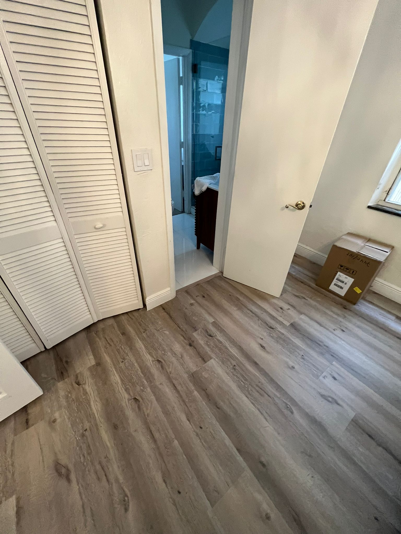 Finished hallway floor connecting bedroom and bathroom areas, Miami Beach repair project