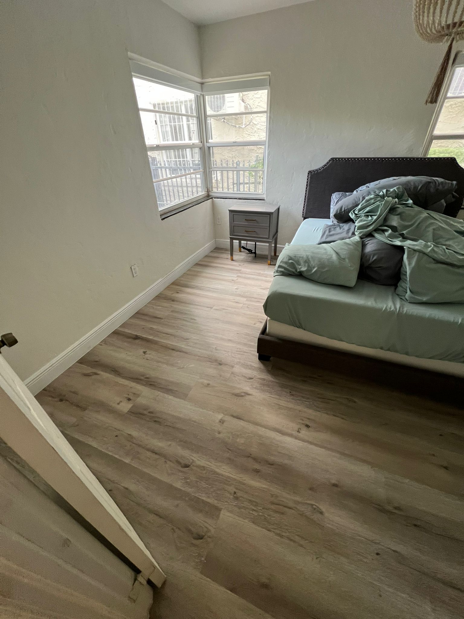 Finished bedroom floor after subfloor repair and new waterproof vinyl installation, Miami Beach