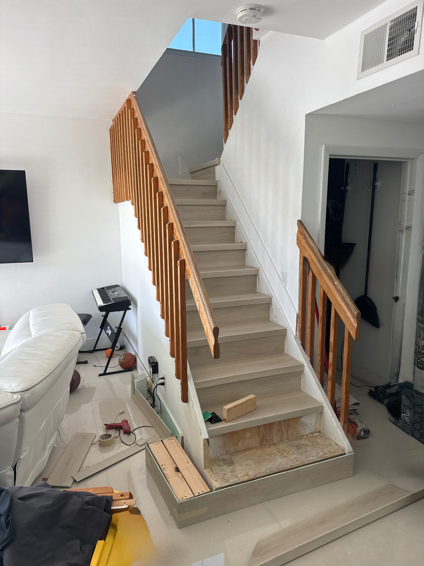 First stair tread being extended to create a wider entrance.
