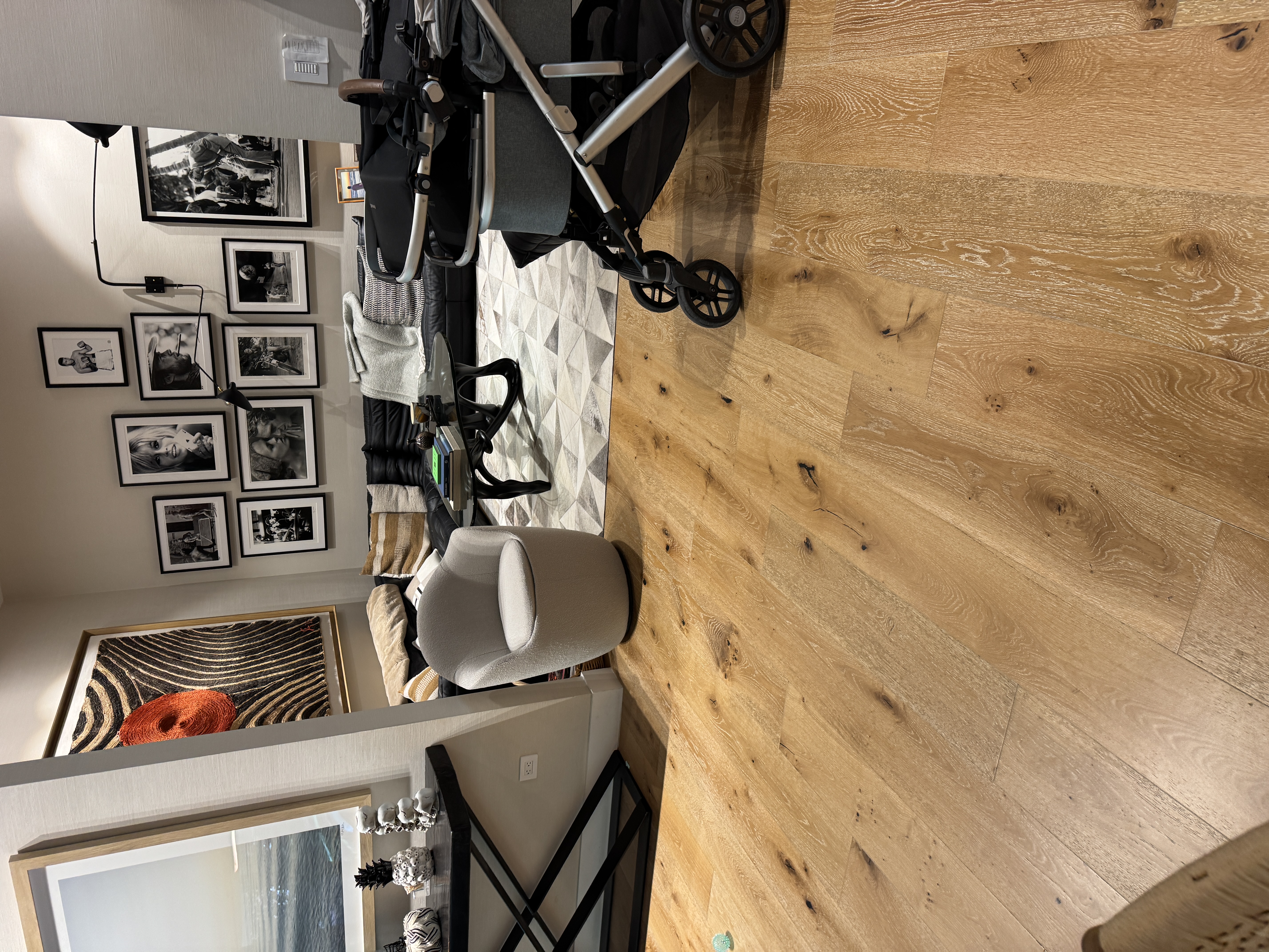 Living room detail near the coffee table with engineered wood flooring in a Pinecrest, FL home.