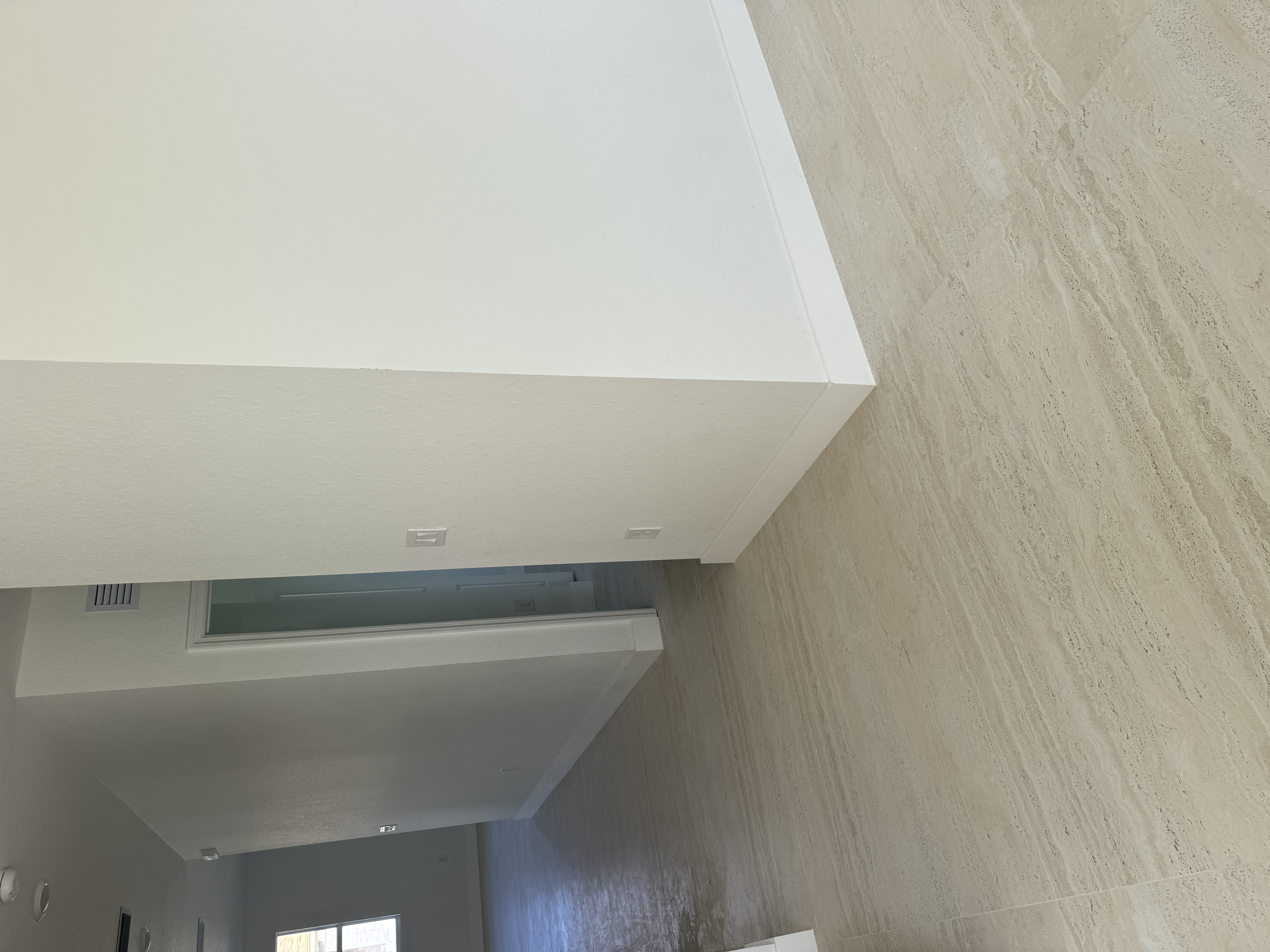 Finished baseboard installation along a wall corner after interior renovation, Miami