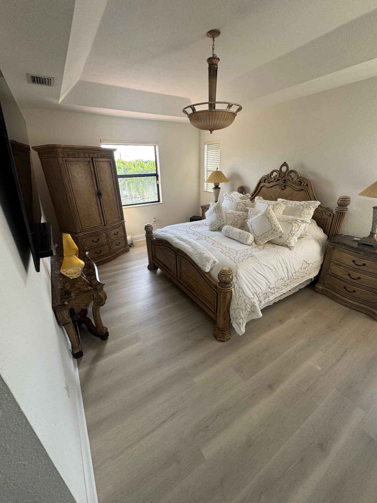 Soft light-toned bedroom flooring installation in a finished South Florida home