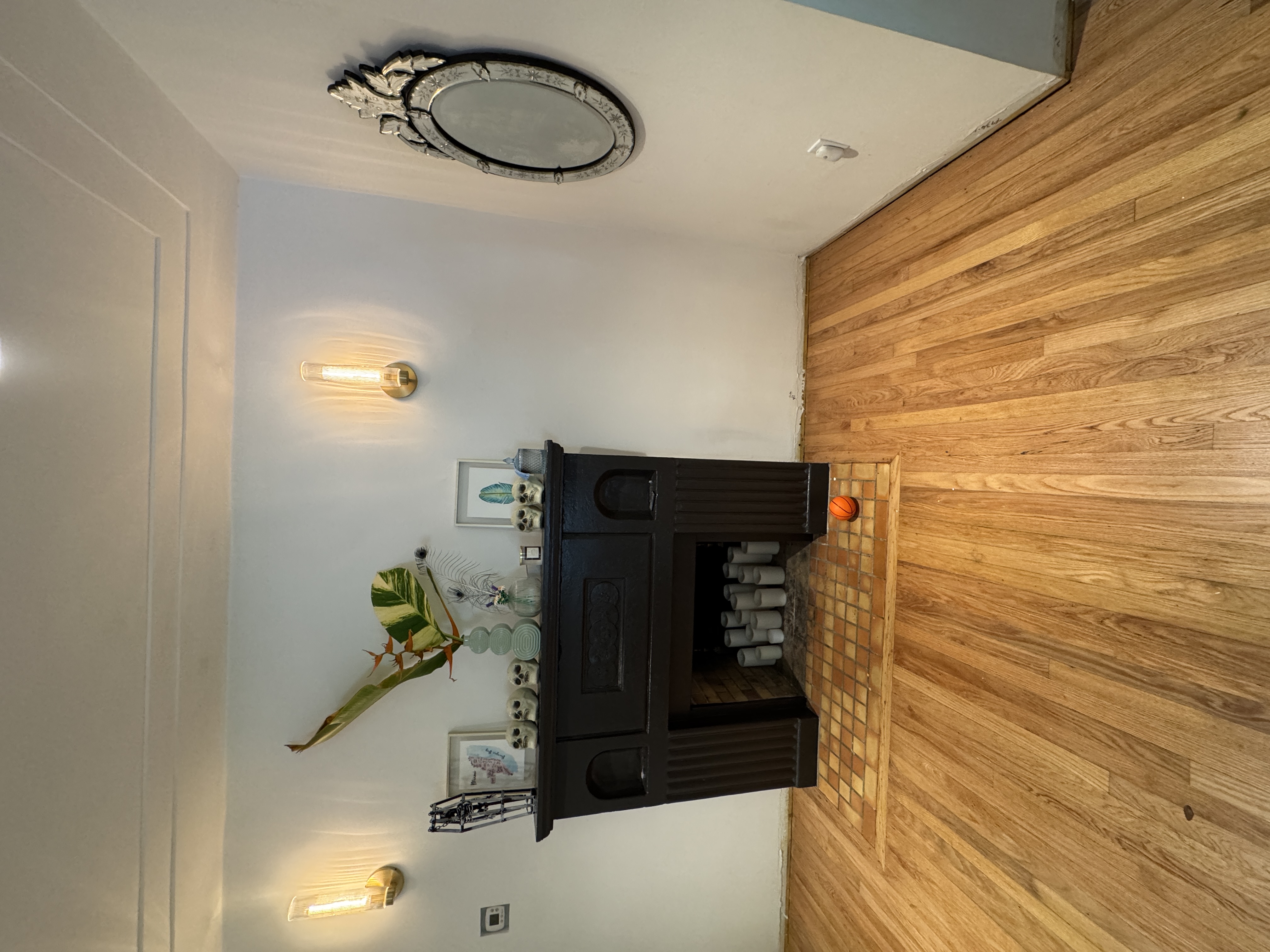 Miami living room with fireplace before baseboard trim installation.