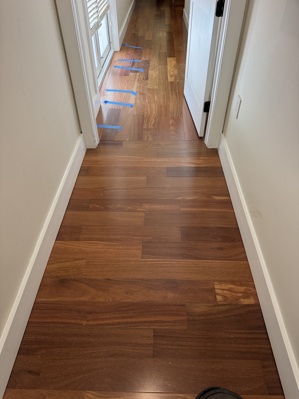 Brazilian Cherry hardwood hallway after completion of the floor repair.