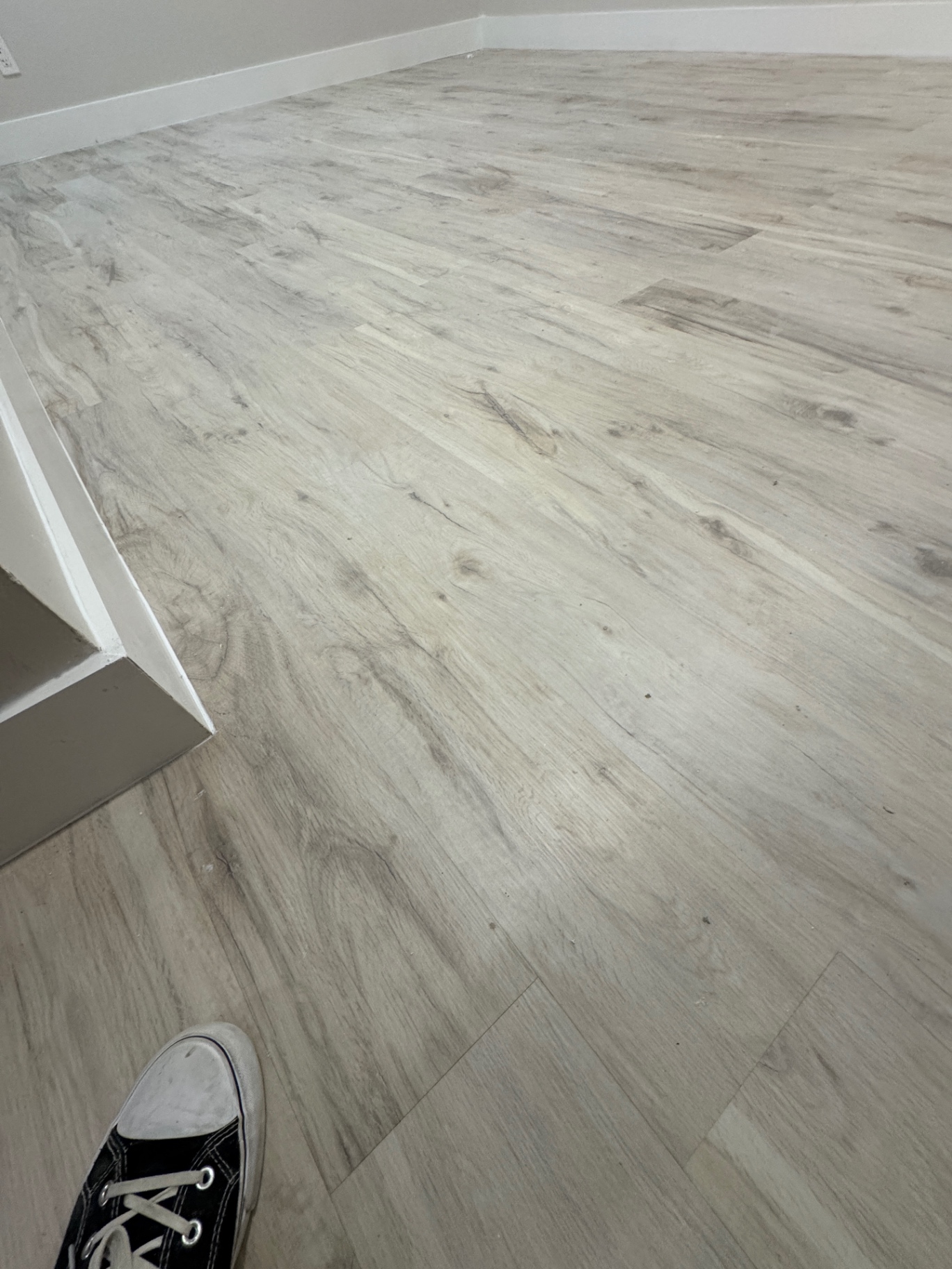 Continuous plank layout after corrective reinstallation of the finished floor.